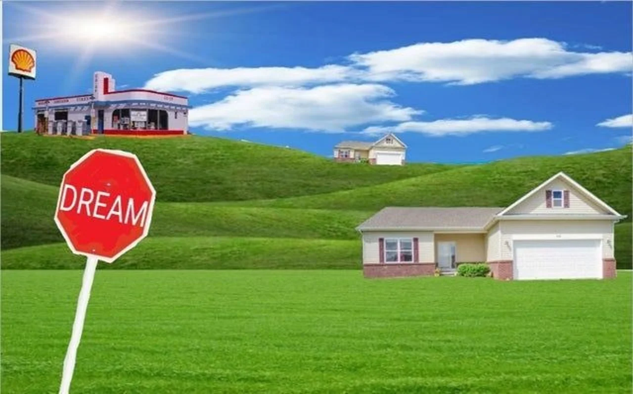 Photoshopped green hills with suburban houses, a Shell gas station and a red octagonal sign reading DREAM