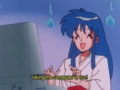 Blue-haired anime girl in white robe smiles at a computer with subtitle "Using the computer is fun!"