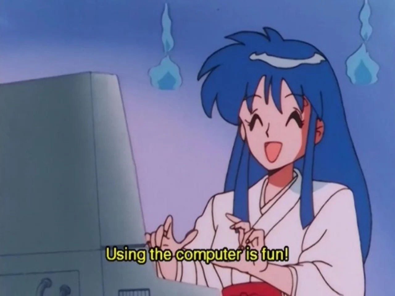 Blue-haired anime girl in white robe smiles at a computer with subtitle "Using the computer is fun!"